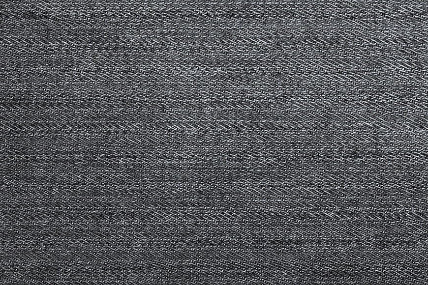 Close-up texture of dark gray denim fabric weave