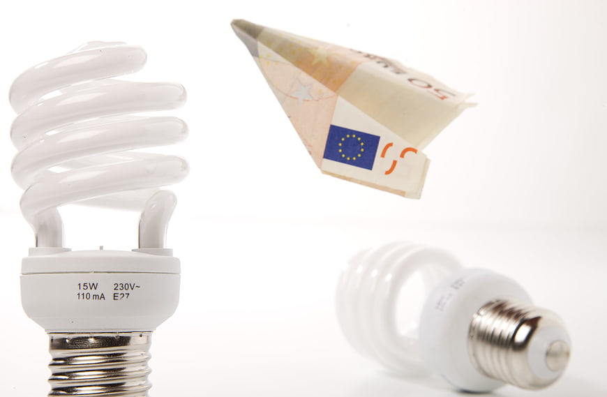 CFL Bulb And Euro Banknote Concept For Energy Savings