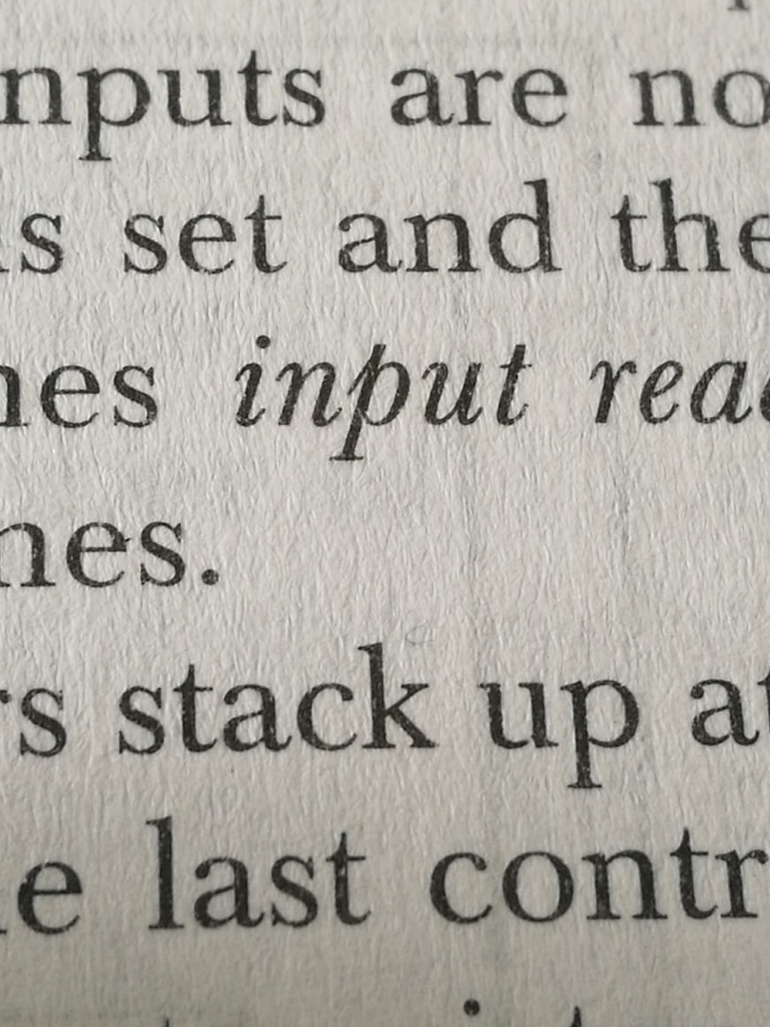 Close-up of printed text on textured paper background