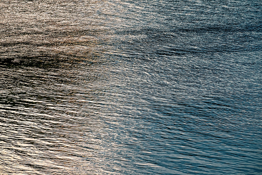 Abstract Water Surface Texture With Sunlight Reflections