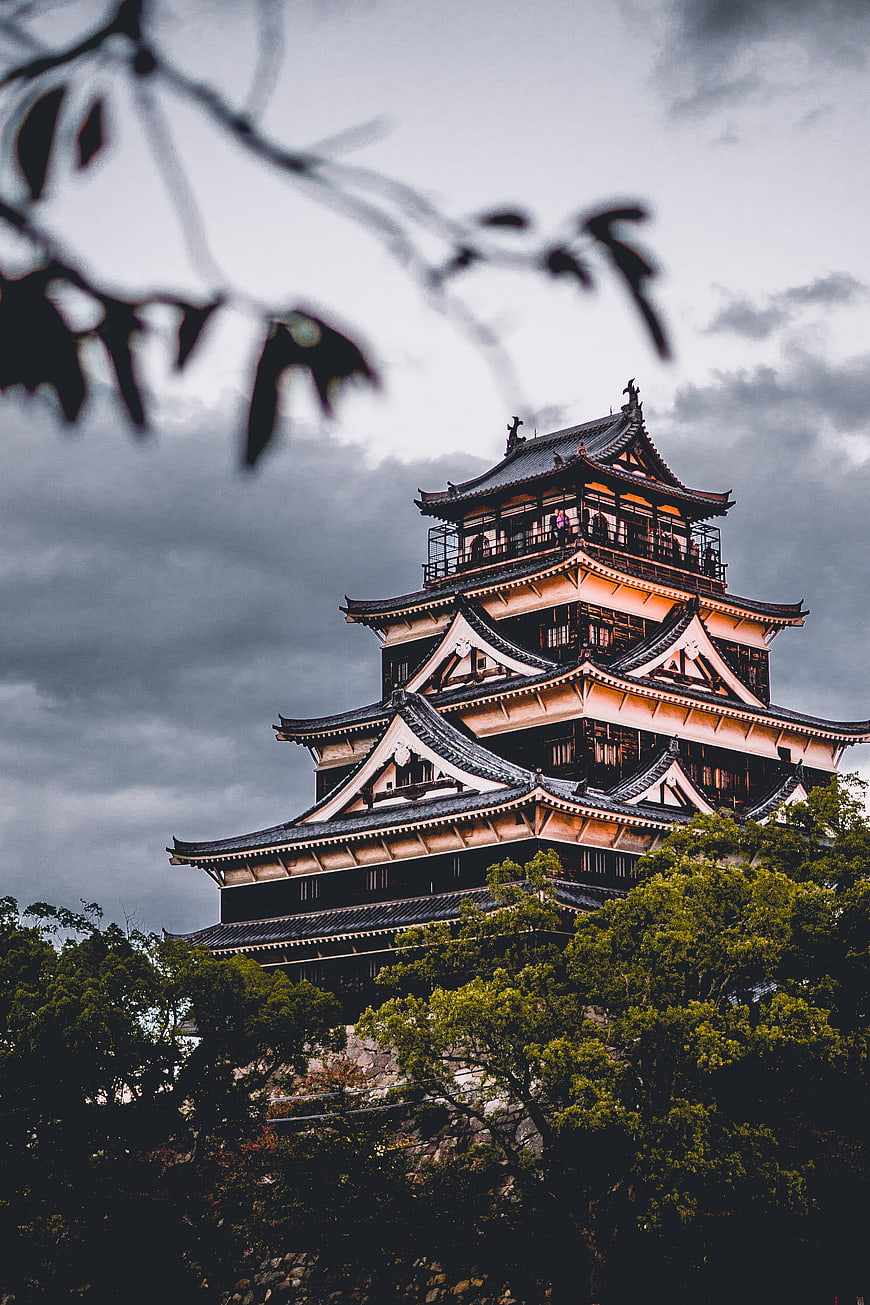 Hiroshima Castle Tower Against Dramatic Cloudy Sky