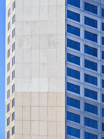 Modern Office Building Corner with Blue Windows and Concrete Facade