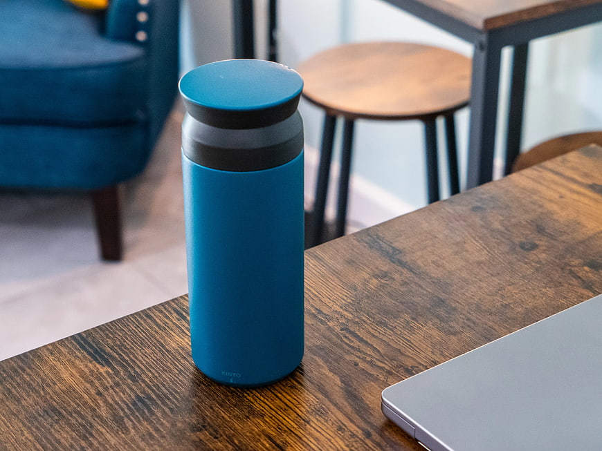 Blue Insulated Tumbler on Wooden Desk with Laptop