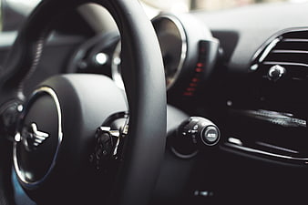 Close-up of Mini Cooper steering wheel and dashboard interior
