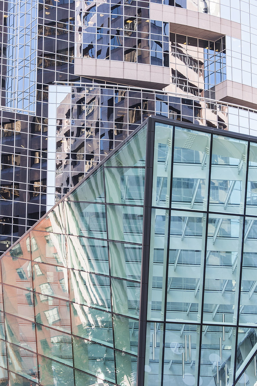 Modern Glass Architecture with Reflections and Geometric Patterns