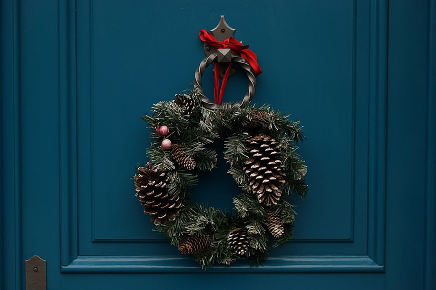 Christmas Wreath with Pine Cones on Blue Door