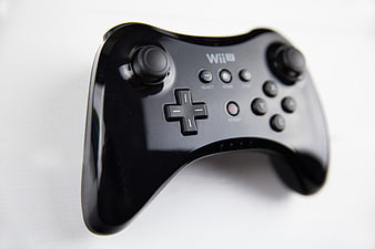 Black Wii U Pro Controller on White Background
