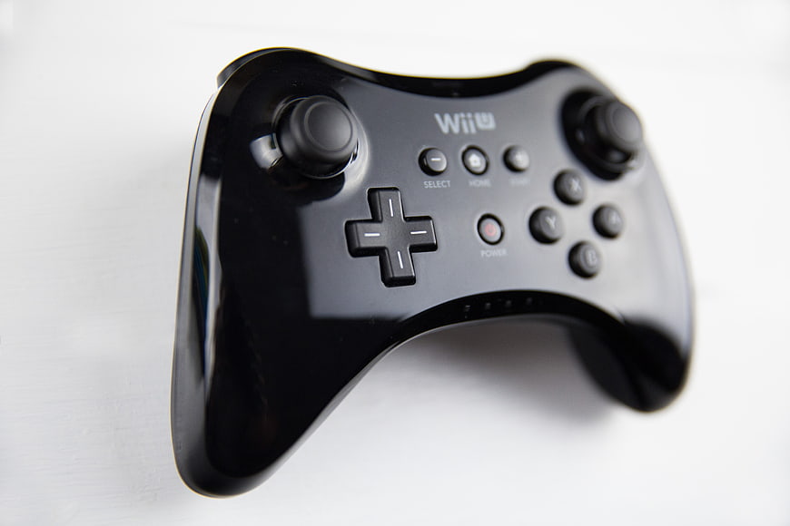 Black Wii U Pro Controller on White Background