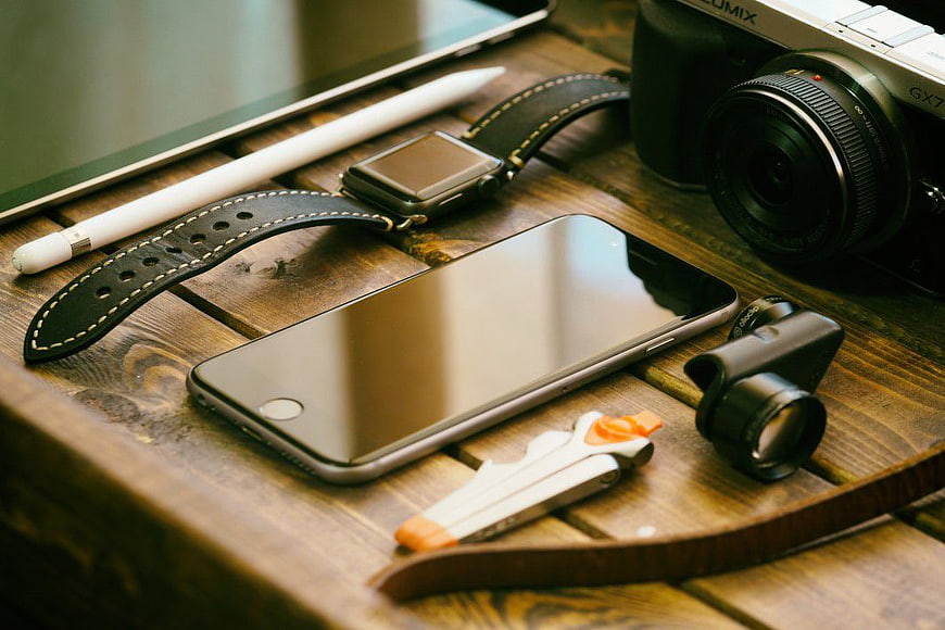 Photography Gear Flat Lay on Wooden Table