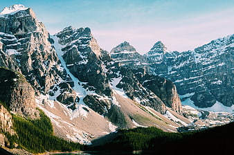 Majestic Snow-Capped Mountain Peaks with Forested Valley