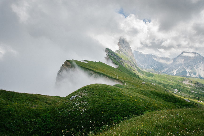 Misty Green Mountain Ridge with Dramatic Clouds