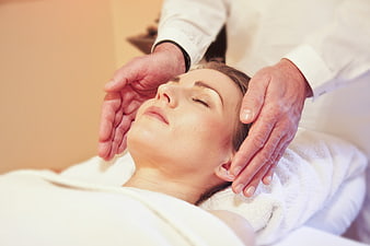 Woman Receiving Head Massage For Relaxation And Wellness