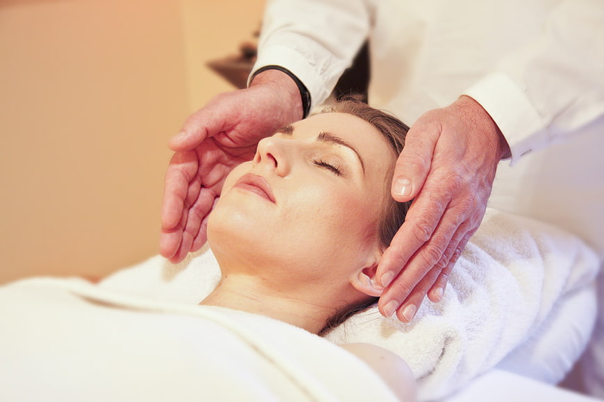 Woman Receiving Head Massage For Relaxation And Wellness