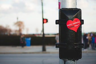 Red Heart Sticker on Urban Street Pole