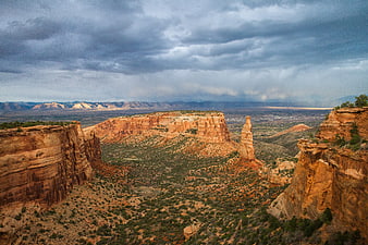 Dramatic Red Rock Canyon Landscape with Stormy Sky