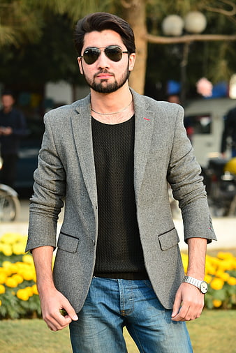 Handsome man in grey blazer and sunglasses outdoors
