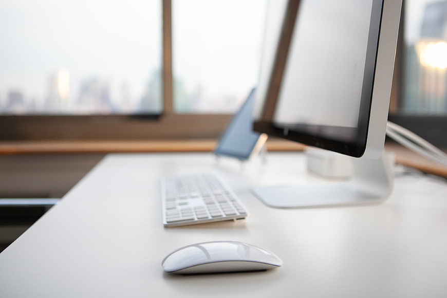 Minimalist White Home Office Desk with Computer and Mouse