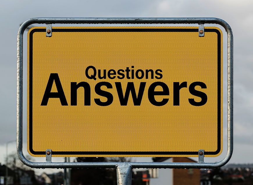 Yellow road sign with questions and answers text