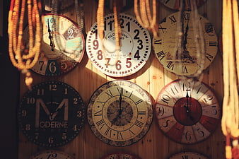 Vintage Wall Clocks on Wooden Background with Beads