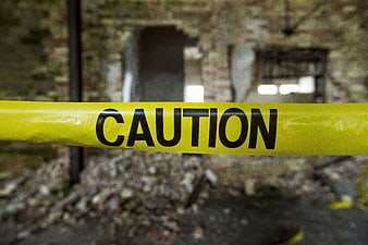 Yellow Caution Tape in Abandoned Building Ruins