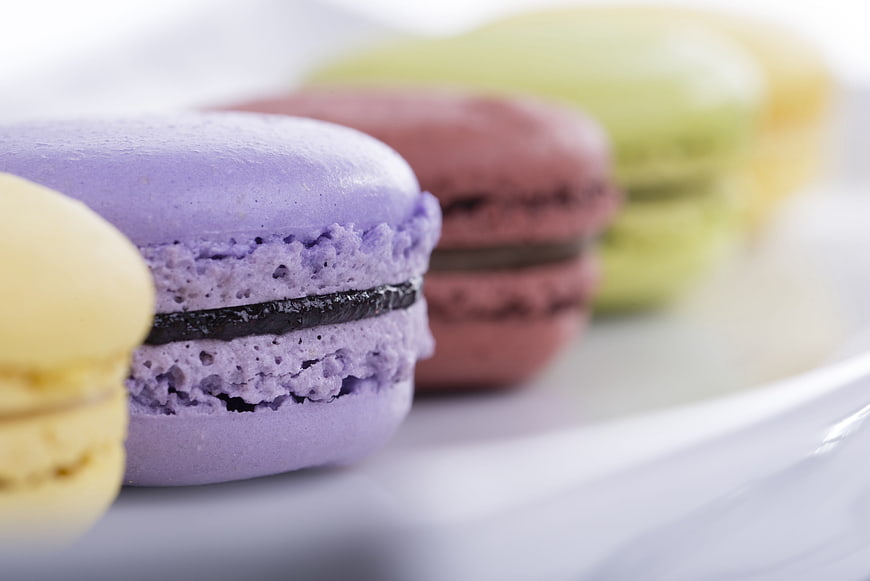 Colorful French Macarons Close-Up on White Plate