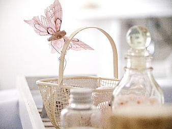 Pink butterfly decoration on spa basket with bath salts