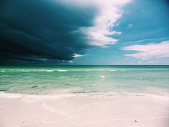 Dramatic Storm Clouds Over Turquoise Tropical Beach