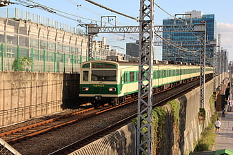 Green and Cream Seoul Metro Train on Elevated Tracks