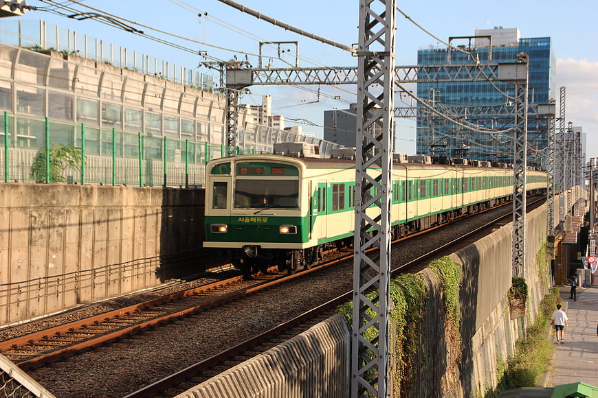 Green and Cream Seoul Metro Train on Elevated Tracks