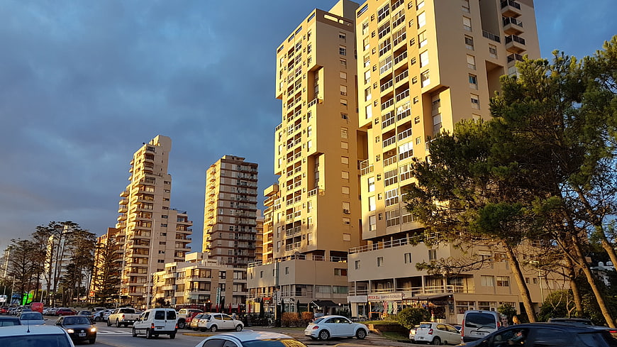 Modern apartment buildings in urban cityscape at sunset
