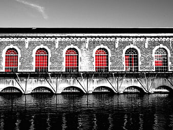 Black and white architecture with selective red window color
