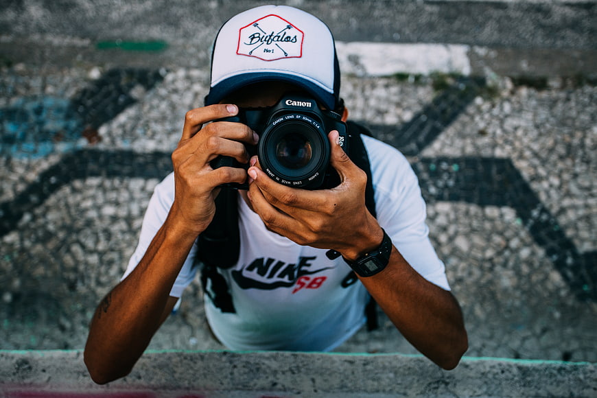High angle view of photographer holding camera