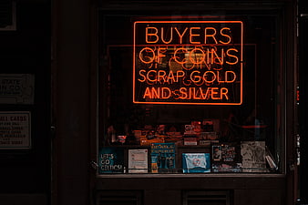 Neon Sign for Coin and Gold Buyers in Shop Window