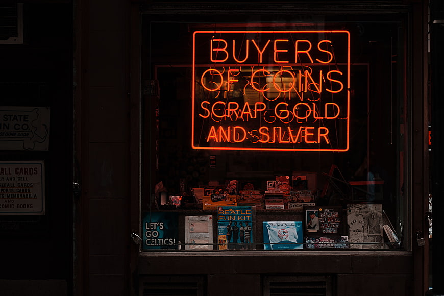 Neon Sign for Coin and Gold Buyers in Shop Window