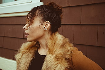 Stylish Woman in Profile Wearing Fur Collar Coat
