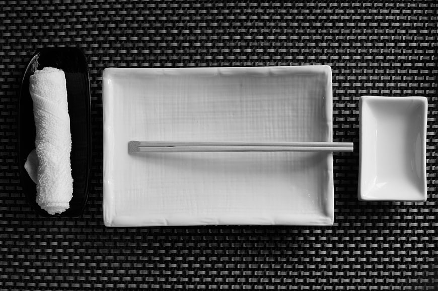 Minimalist Japanese Table Setting with Chopsticks and Oshibori