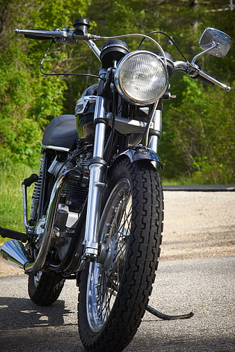 Classic Black Motorcycle with Chrome Details on Road