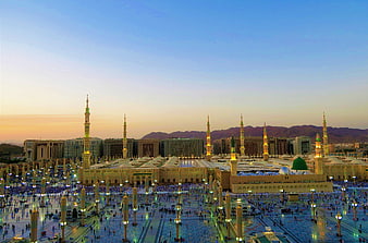 Masjid al-Nabawi in Medina at Dusk with Minarets and Prayer Courtyard