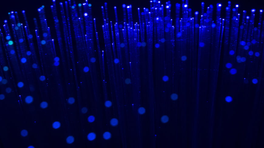 Abstract Blue Fiber Optic Light Strands On Black Background