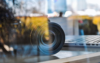 Canon DSLR Camera and Laptop in Cafe Window