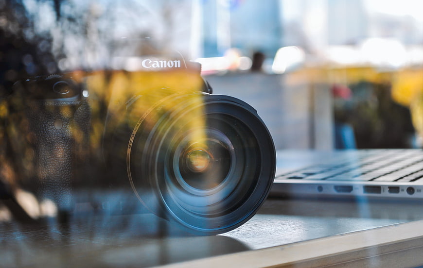 Canon DSLR Camera and Laptop in Cafe Window
