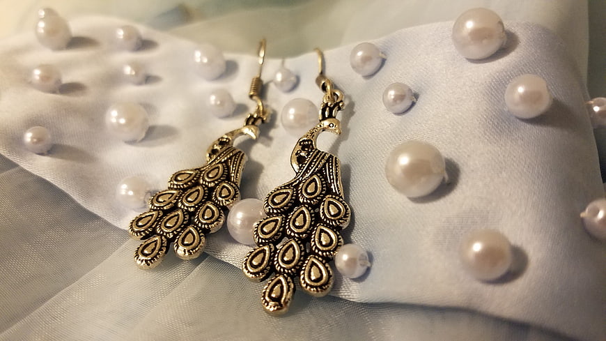 Vintage Peacock Earrings on White Fabric with Pearls