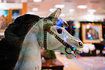 Vintage Wooden Horse Head with Festive Bokeh Lights