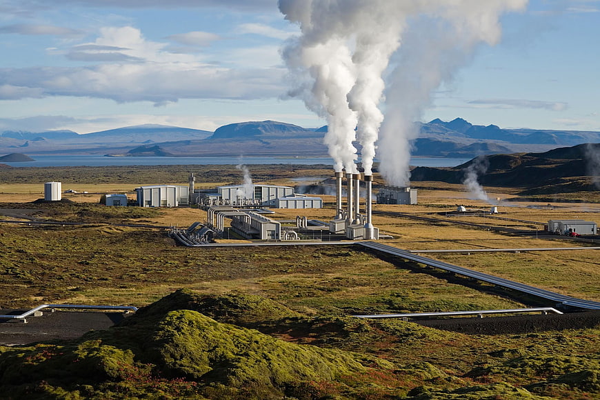 Geothermal power plant in Iceland with steam rising
