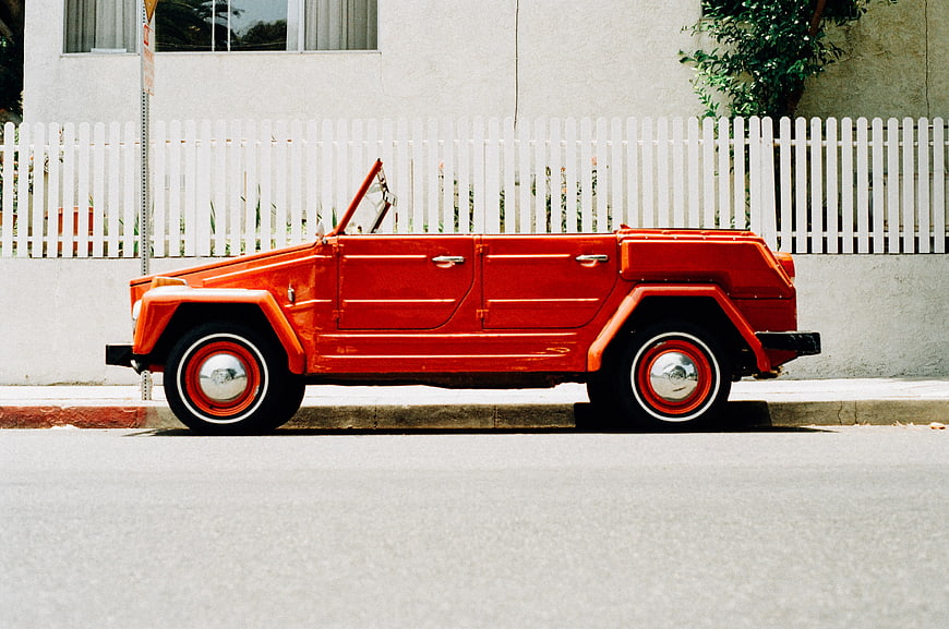 Vintage Red Convertible Car Parked on Street
