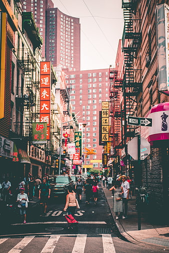 Busy Chinatown Street in New York City with Neon Signs