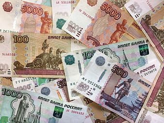 Scattered Russian Ruble Banknotes in Various Denominations