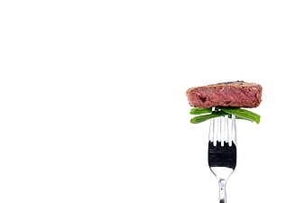 Rare Steak And Green Beans On Fork Against White Background