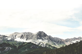 Majestic Mountain Landscape with Misty Clouds and Forest