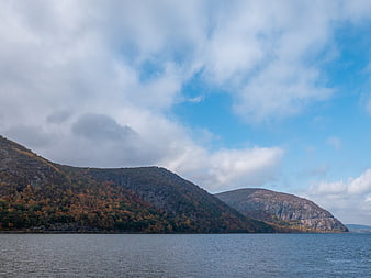 Scenic autumn mountains and river landscape with blue sky